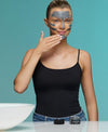 revivalist charcoal detox mask on face